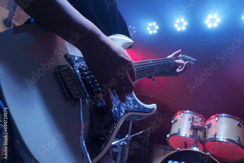 The guitarist of the band performed on stage photo