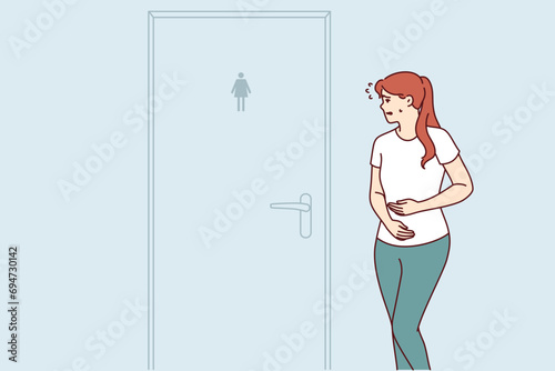 Woman suffering from diarrhea rushes to toilet standing near closed door due to stomach problems. Concept poor digestion causing diarrhea and need for help from gastroenterologist doctor