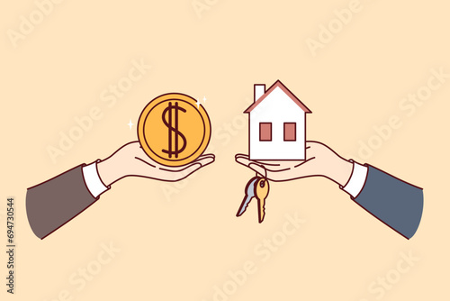 Real estate transaction when buying or renting house, with hands holding money and miniature cottage with keys. Realtor or broker sells apartment to buyer wants to invest in own real estate