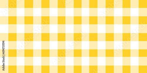 yellow gingham fabric. yellow and white tablecloth background pattern. square linen fabric napkin for backdrop, picnic minimalism, copy space for text, wallpaper