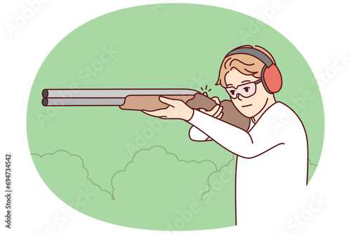 Man in headphones and glasses shoot with rifle in shooting gallery. Guy with weapon in hands hunting in park. Vector illustration.