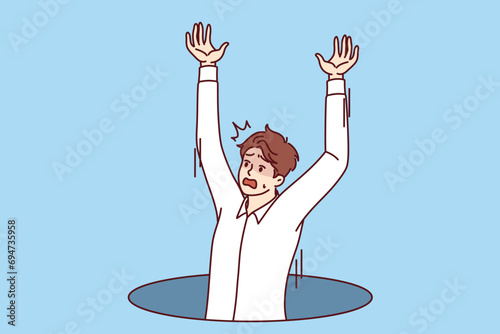 Man falls into hole or sewer hatch and screams in fear, calling on passers-by for help. Falls of businessman as metaphor for problems at work and business failures associated with lack professionalism