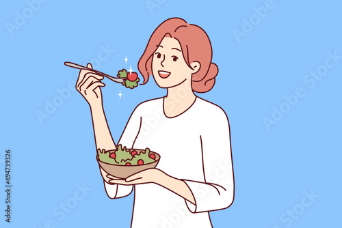 Woman follows diet by eating green seaweed salad to get rid of diseases and lead healthy lifestyle. Happy girl enjoying organic vegetable food following diet as recommended by nutritionist
