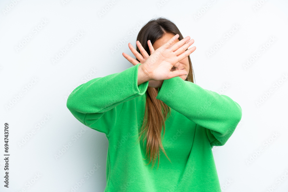 Young caucasian woman isolated on white background nervous stretching hands to the front Young caucasian woman isolated on white background nervous stretching hands to the front