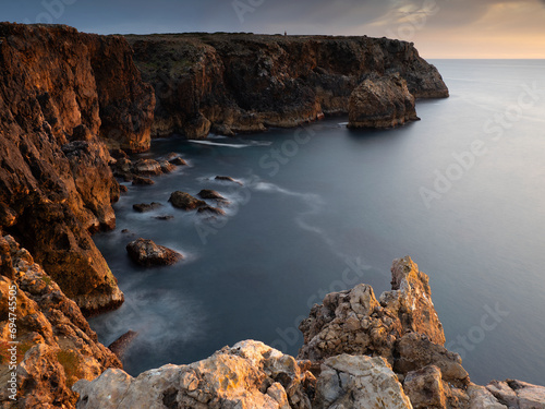 Portugal, Algarve, Scenic cliffs of Vicentine Coast Natural Park at dusk photo