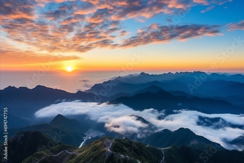 Aerial view of sunrise over the mountains, foggy and cloudy, clouds, mountain peaks