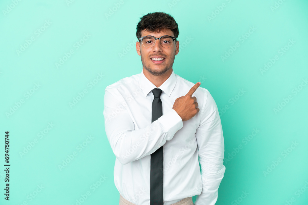 Business caucasian man isolated on blue background pointing to the side to present a product Business caucasian man isolated on blue background pointing to the side to present a product