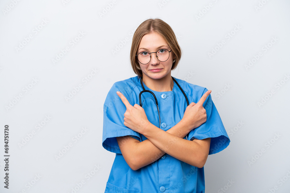Young nurse doctor woman isolated on white background pointing to the laterals having doubts Young nurse doctor woman isolated on white background pointing to the laterals having doubts