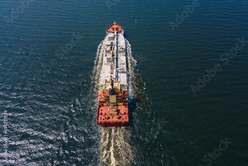 Aerial view of a heavy loaded cement cargo vessel in transit in sea photo