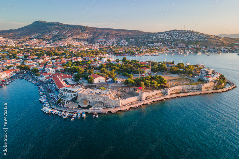 Ancient castle in Foca or Phokaia resort town in Izmir region at sunset, aerial view - obrazy, fototapety, plakaty 