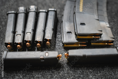 Pistol magazines with cartridges, close-up photo.