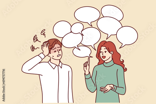 Chatty woman irritates man clutches head and does not want to listen to girl standing among speech bubbles. Guy is experiencing tension and discomfort due to chatty girlfriend spreading gossip.