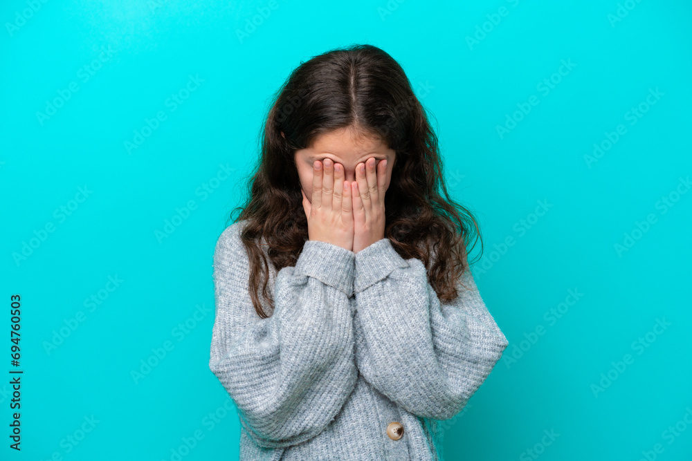Little girl isolated on blue background with tired and sick expression Little girl isolated on blue background with tired and sick expression