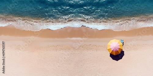 Panoramic aerial view of tropical beach. Shore, sand beach, blue sea and sun beach umbrella.