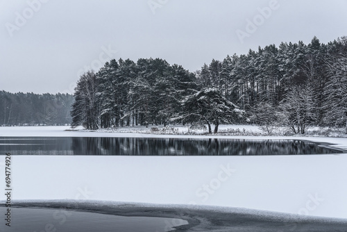 WINTER ATTACK - A frozen lake and snow covered trees on the banks © Wojciech Wrzesień
