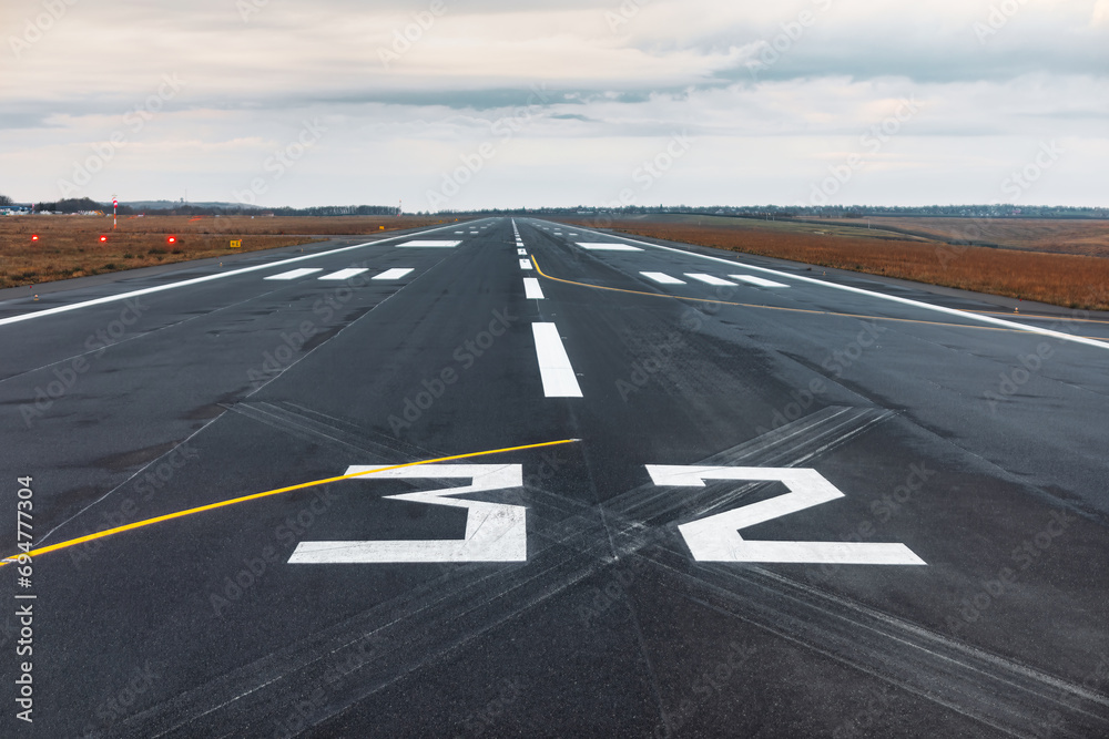 Airport runway with markings on the asphalt. The concept of travel and tourism