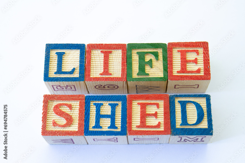 The phrase life shed displayed visually on a clear background with copy space The phrase life shed displayed visually on a clear background with copy space