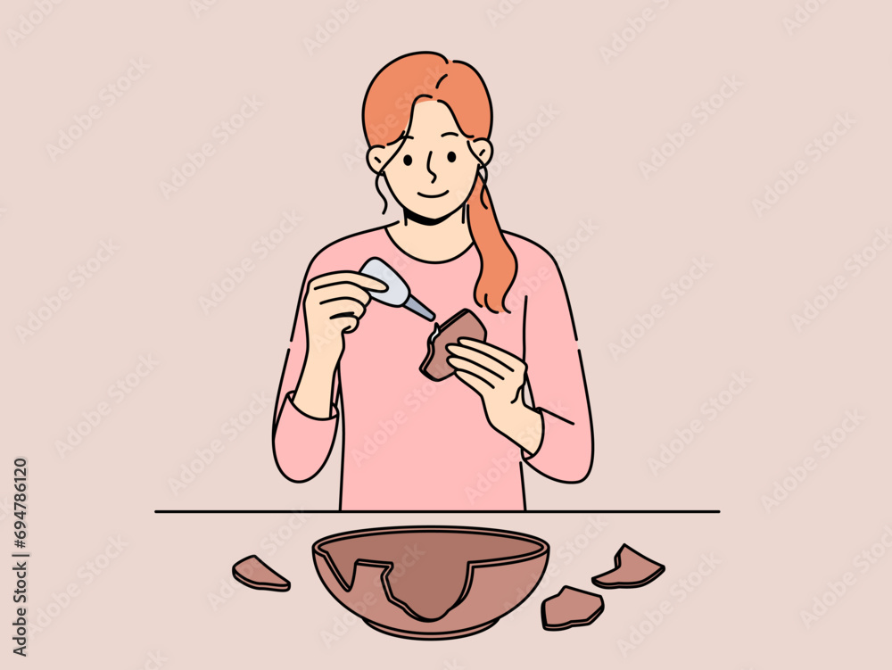 Woman seals broken clay plate to hide carelessness or demonstrate conscious consumption. Girl archaeologist with smile uses glue restoring clay dishes found at excavations for display in museum.