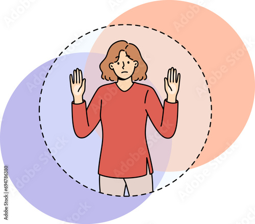 Sad woman cannot get out transparent circle symbolizing comfort zone and stands with hands raised. Girl needs help of psychologist to expand comfort zone and deliverance from psychological framework