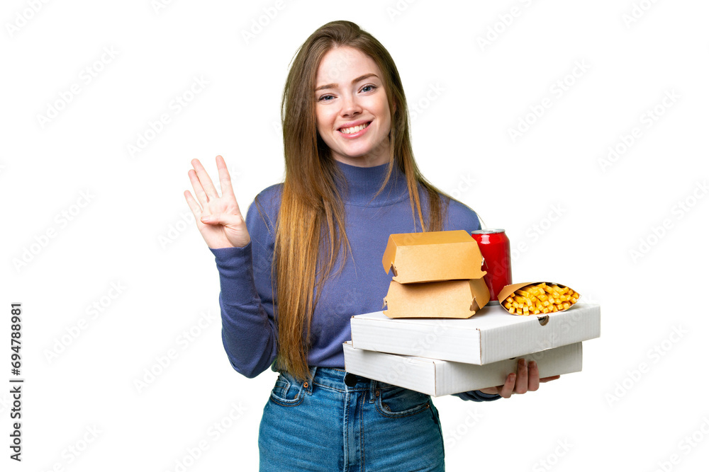 Young pretty woman holding pizzas and burgers over isolated chroma key background happy and counting four with fingers