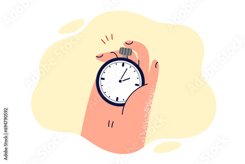 Stopwatch in hand of person noting time at sports competition of runners fighting for first place