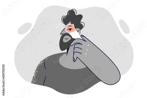 Depressed monochrome man tears paper looking out of hole to free himself from psychological problems
