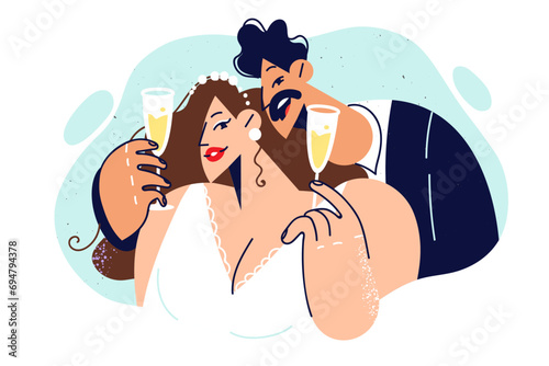 Newlyweds drink champagne at wedding ceremony and make toast wishing themselves happy family life