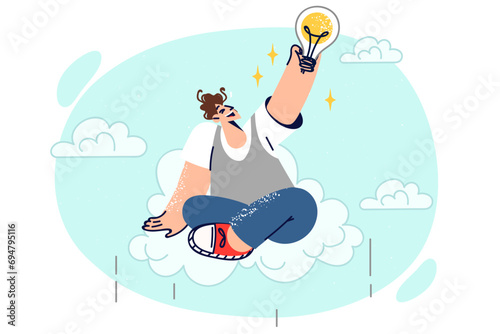 Happy man invented new idea sits on cloud and grabs light bulb and dreams of implementing plans