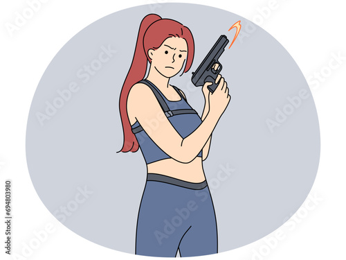 Woman in uniform holding gun