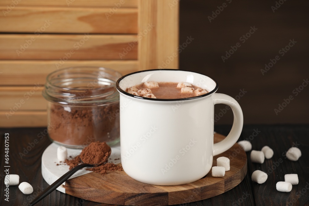 Cup of aromatic hot chocolate with marshmallows and cocoa powder served on table Cup of aromatic hot chocolate with marshmallows and cocoa powder served on table