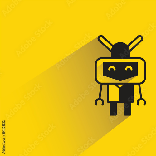 robot with shadow on yellow background