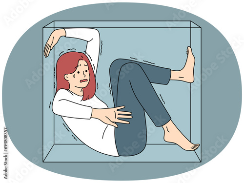 Stressed woman scared sitting in box