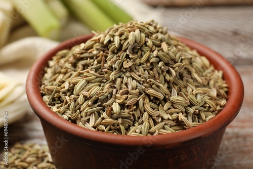 Fennel seeds in bowl on table, closeup