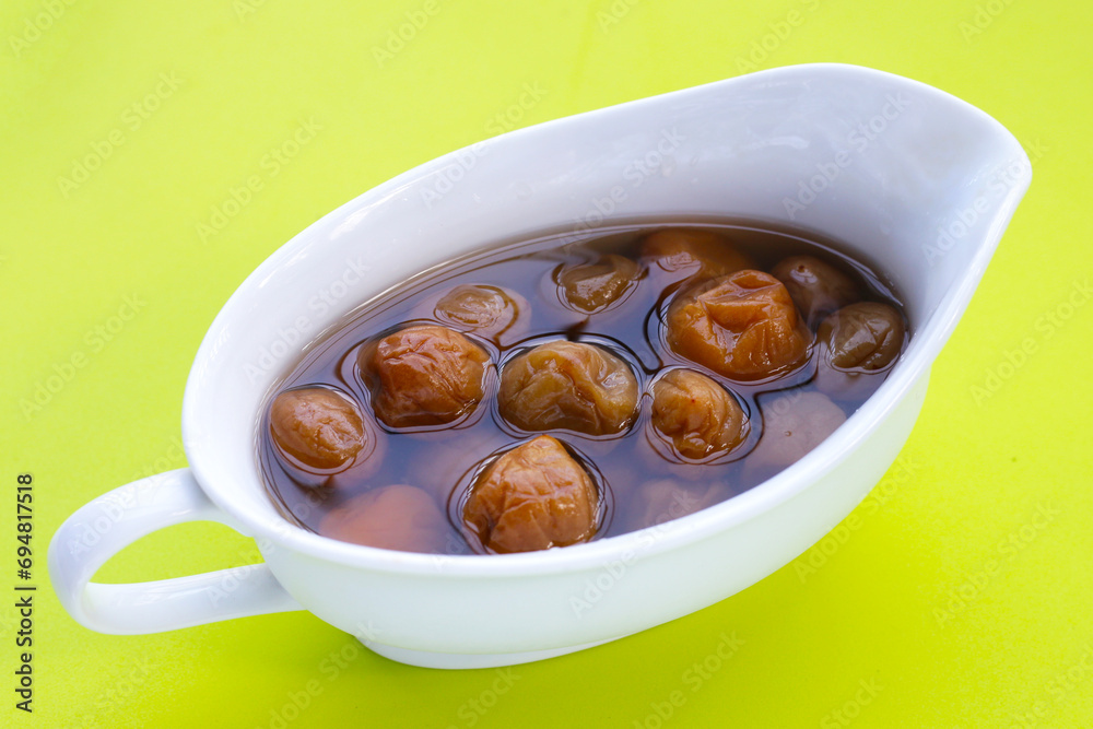 Pickled plums on white background. Pickled plums on white background.