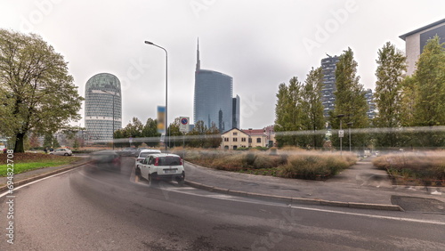 Panorama showing skyscrapers and towers from park with green lawn timelapse in Milan