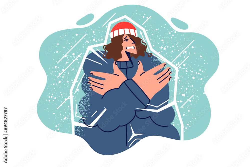 Frozen woman inside icy iceberg, shivering due to lack of warm clothing, stands among falling snow Frozen woman inside icy iceberg, shivering due to lack of warm clothing, stands among falling snow