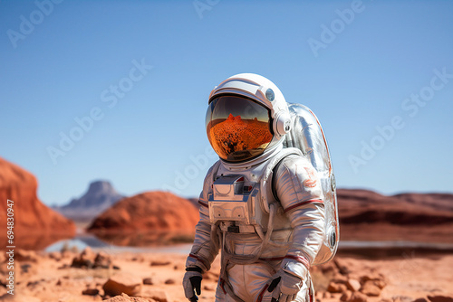 Astronaut exploring a Martian-like landscape photo