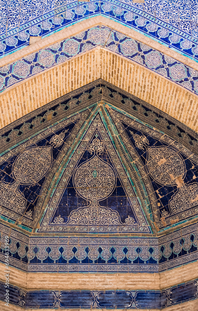 The facade of the madrasah is lined with mosaic glaze and ceramic tiles ...