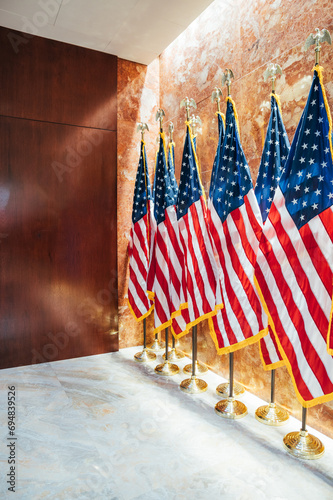 American flags on stands in embassy hall photo