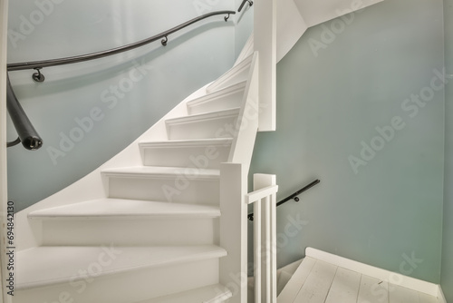 Bright hallway with white stairs photo