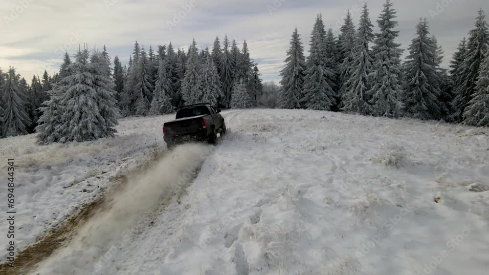 Traveling by car to the winter mountains. Wild Carpathian forest. Expedition to the mountains. Top cinematic aerial view. Ukrainian wild nature Traveling by car to the winter mountains. Wild Carpathian forest. Expedition to the mountains. Top cinematic aerial view. Ukrainian wild nature
