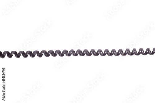 Black spiral telephone cord isolated on white background. photo