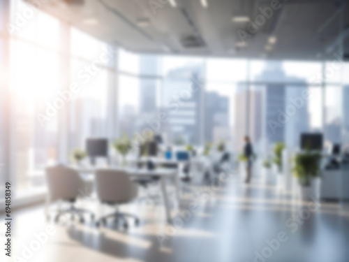 Blurred office interior background with vivid natural lights in cityscape view in a high building. Commercial buildings or Business concept.