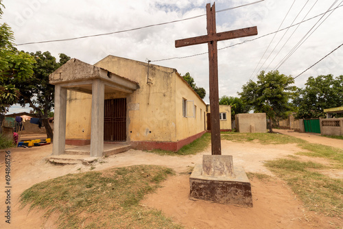 Small evangelical church building in Africa, adorned with a wooden cross