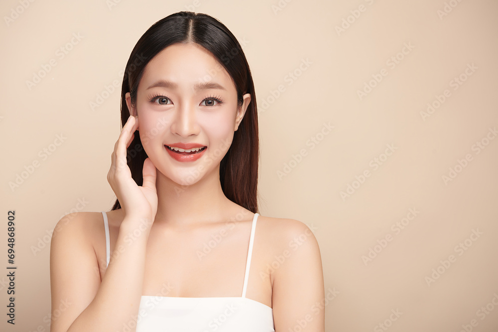 Beautiful young asian woman with clean fresh skin on beige background, Face care, Facial treatment, Cosmetology, beauty and spa, Asian women portrait. Beautiful young asian woman with clean fresh skin on beige background, Face care, Facial treatment, Cosmetology, beauty and spa, Asian women portrait.