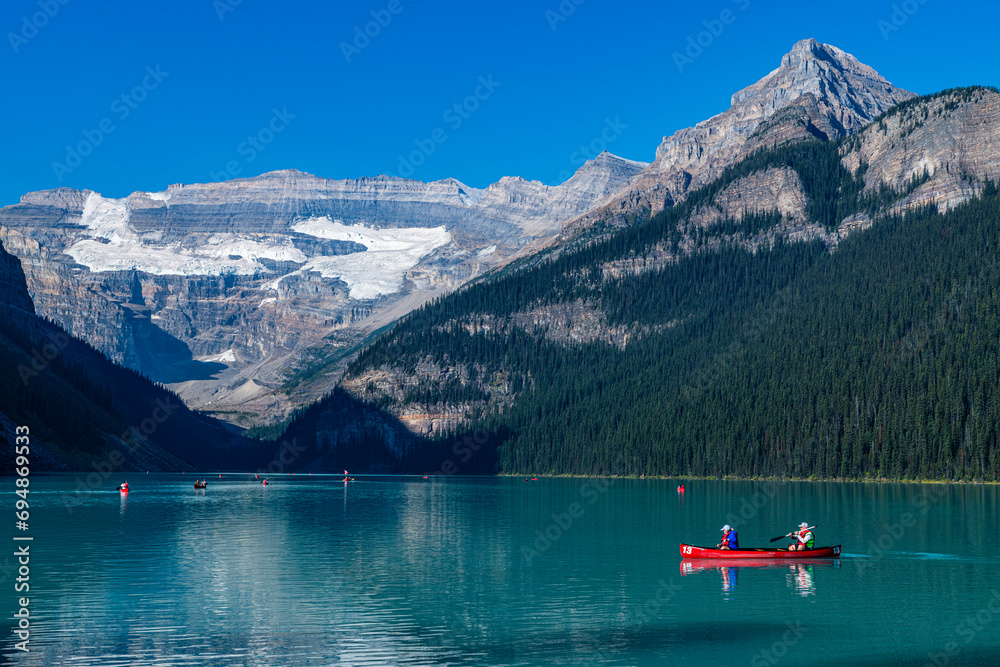 Kayakers on Lake Louise, Banff National Park, UNESCO World Heritage Site, Alberta, Rocky Mountains, Canada Kayakers on Lake Louise, Banff National Park, UNESCO World Heritage Site, Alberta, Rocky Mountains, Canada