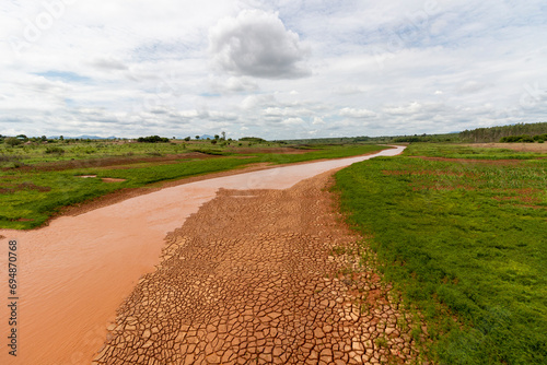 Intricate network of mudcracks dominates the view of river Revué in Mozambique, Africa