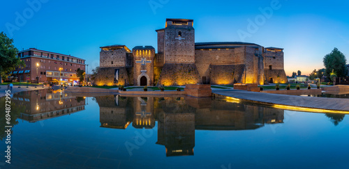 View of Castel Sismondo reflecting in ornamental water in Rimini at dusk, Rimini, Emilia-Romagna photo