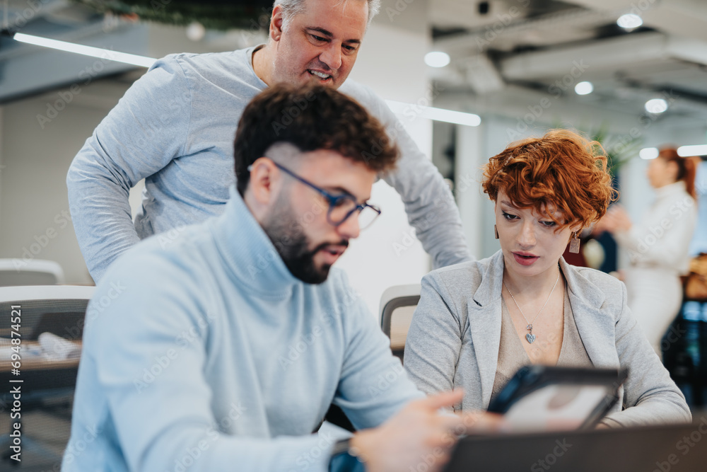 Successful collaboration of multiracial businesspeople in creative corporate office. Successful collaboration of multiracial businesspeople in creative corporate office.