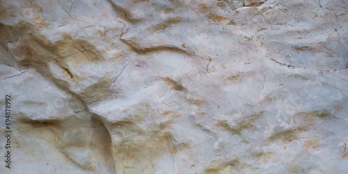 Marble pattern from natural marble The pattern is irregular. Natural pattern, white, gray, arranged in natural curves. Untidy, looks clean, the surface is not smooth and has raised marks following the